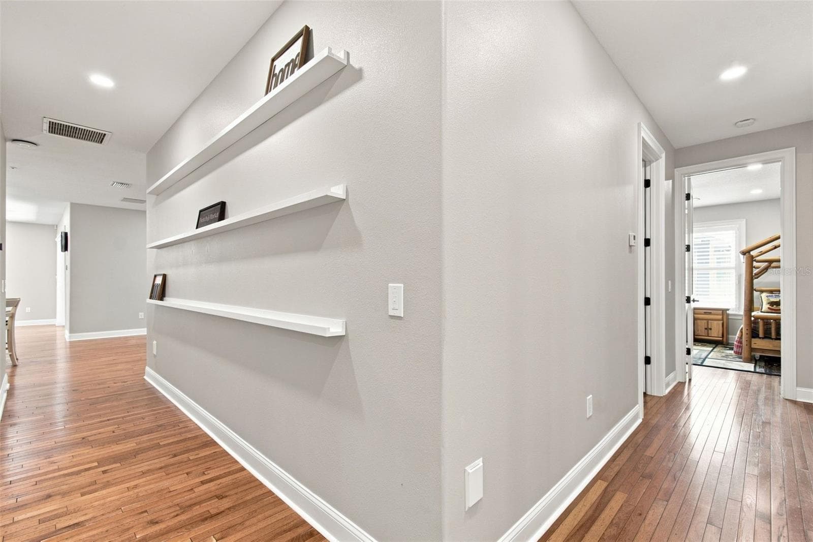 HALLWAY WITH ATTACHED SHELVING FOR PICTURES - 14122 CHESTERFIELD TRL, HUDSON