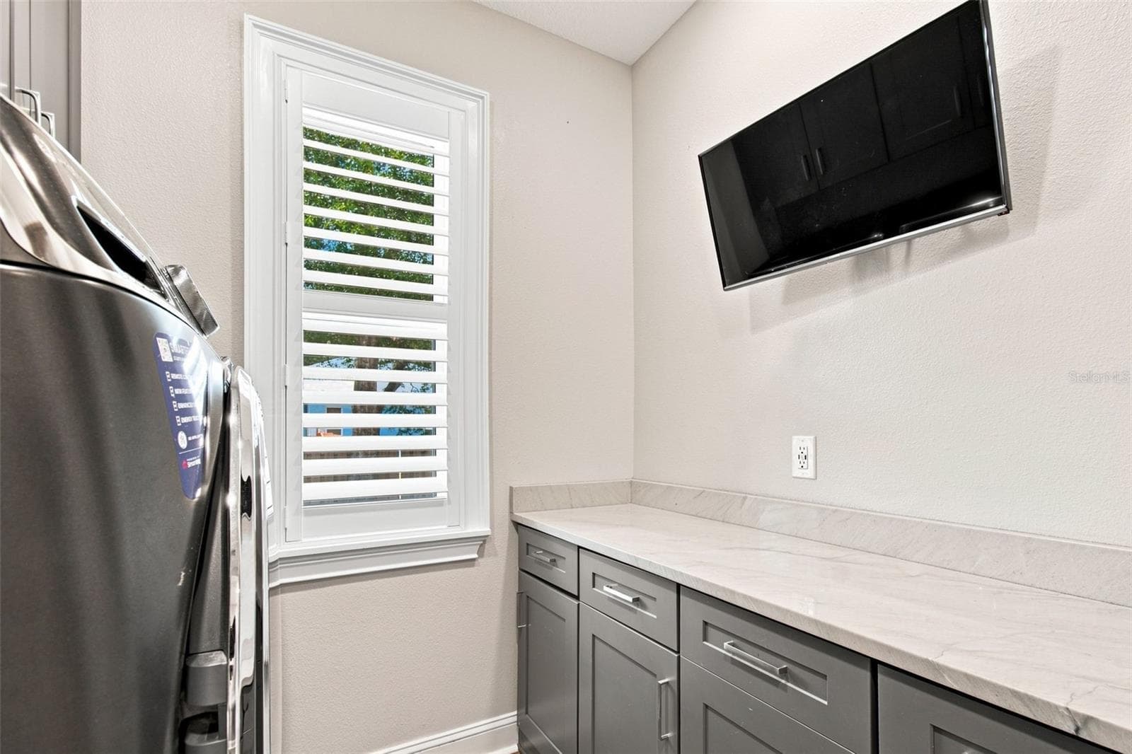 LAUNDRY ROOM WITH TV FOR YOUR FOLDING PLEASURE - 14122 CHESTERFIELD TRL, HUDSON