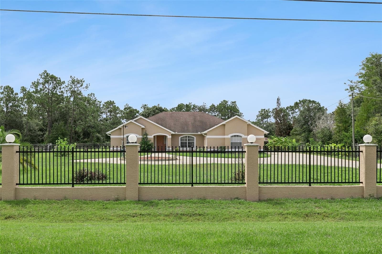 Front of property showing decorative fence - 19532 SHELDON ST, ORLANDO