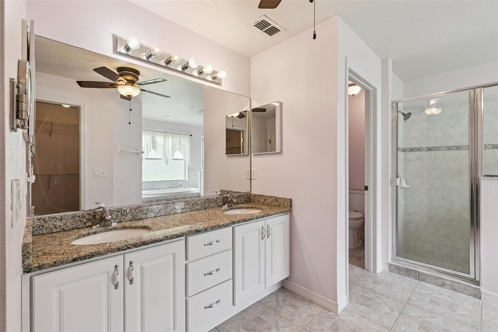 Primary bathroom with granite countertops. - 19532 SHELDON ST, ORLANDO