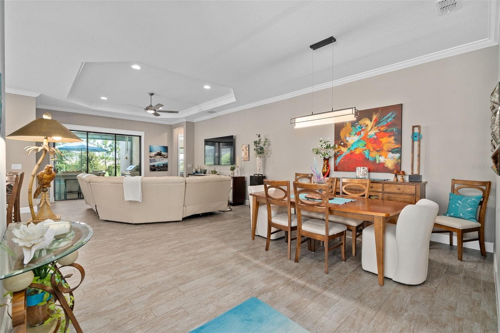 Dining room / Great room view. The 10' ceilings in addition to the tray's and crown molding add another dimension. - 1279 ZEEK RIDGE ST, CLERMONT