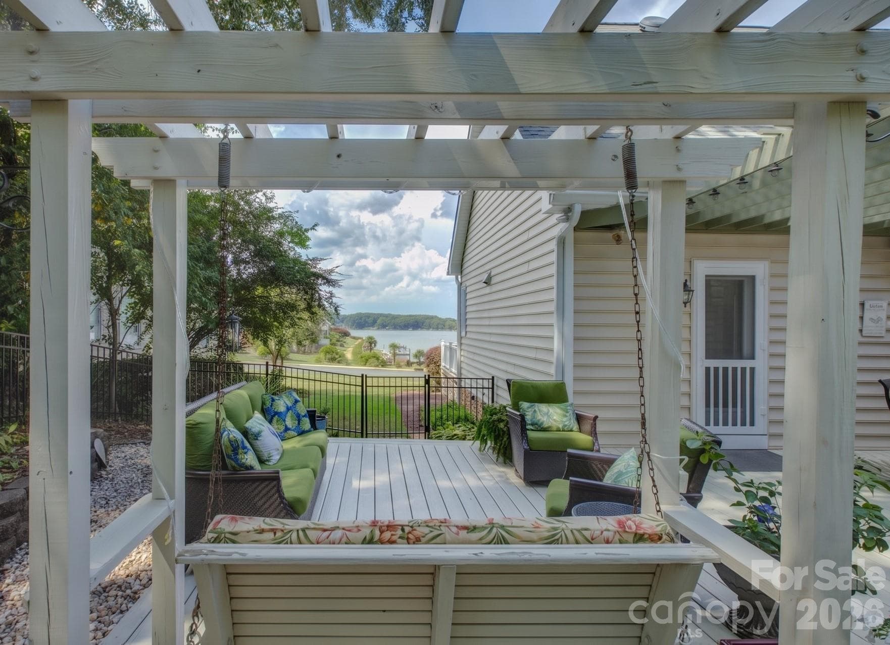 The rear porch swing offers an exceptional and scenic view of the lake. - 946 Lake Club Drive, Rock Hill