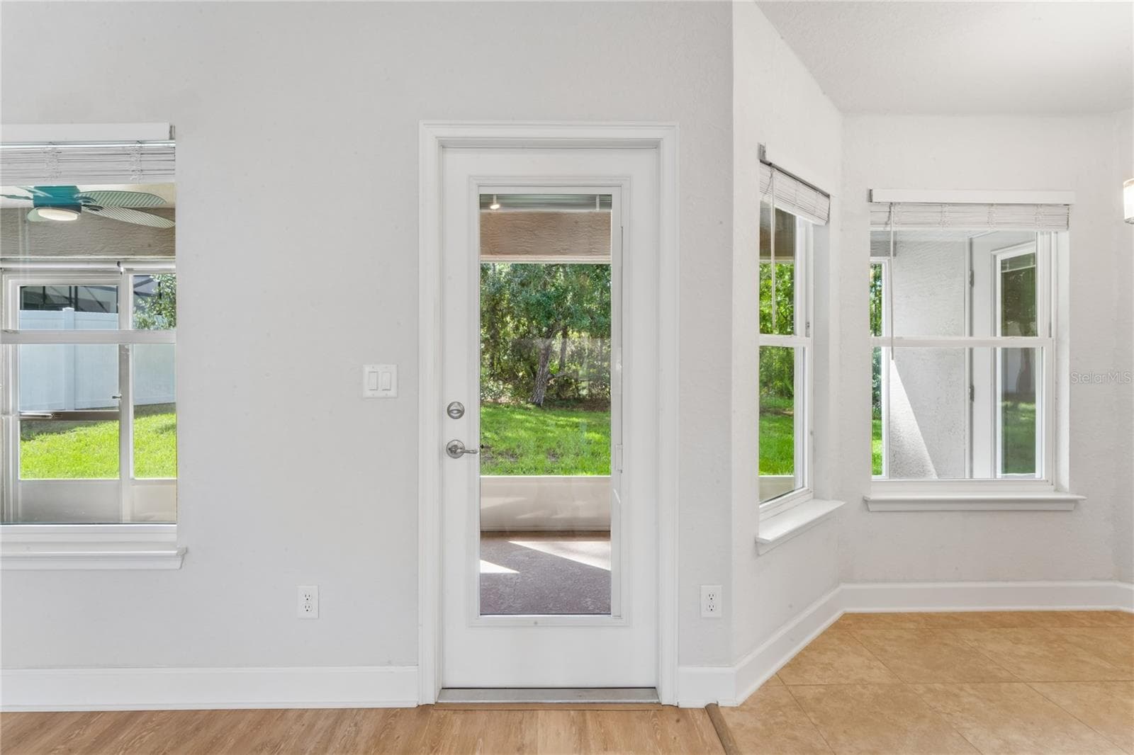French door leading from great room to screened lanai - 145 LINDER DR, HOMOSASSA