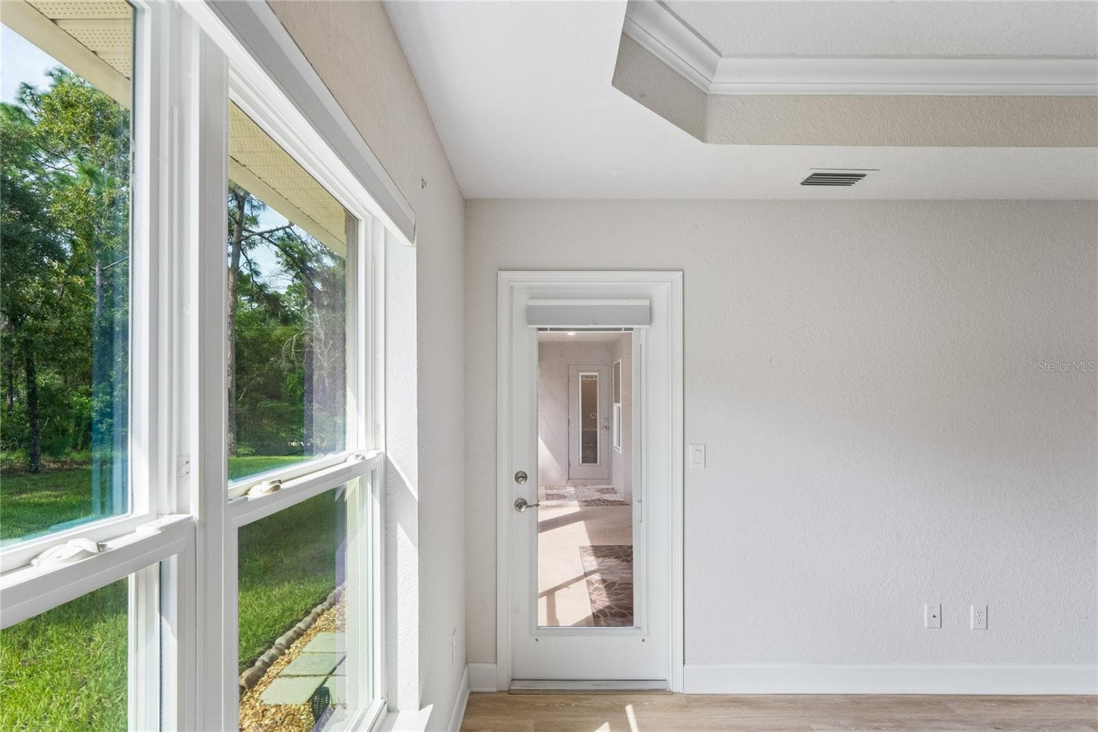 Primary Bedroom suite leading to screened lanai - 145 LINDER DR, HOMOSASSA