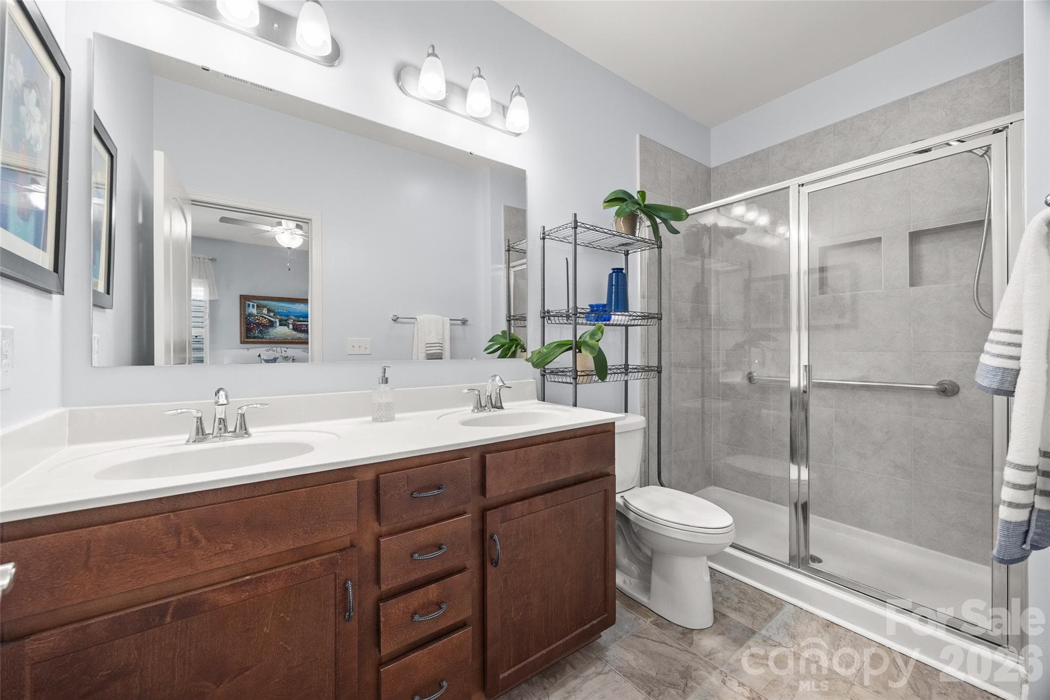 Primary bathroom with double vanity and walk-in shower - 22444 Gateway Drive, Lancaster