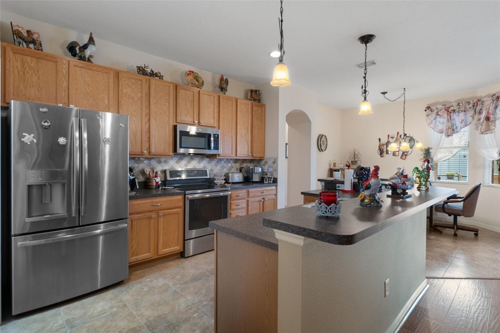 Kitchen with stainless steel appliances - 14056 LEYBOURNE WAY, SPRING HILL