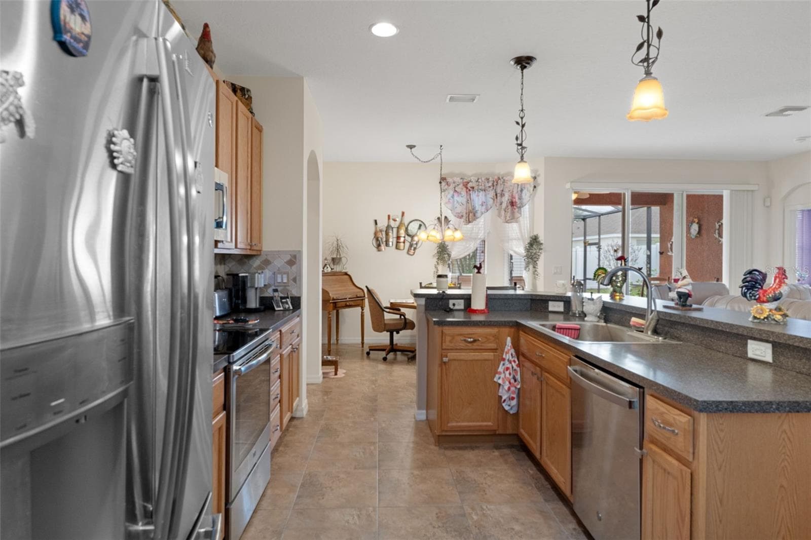 Kitchen with a an abundance of cabinets and counter top space - 14056 LEYBOURNE WAY, SPRING HILL