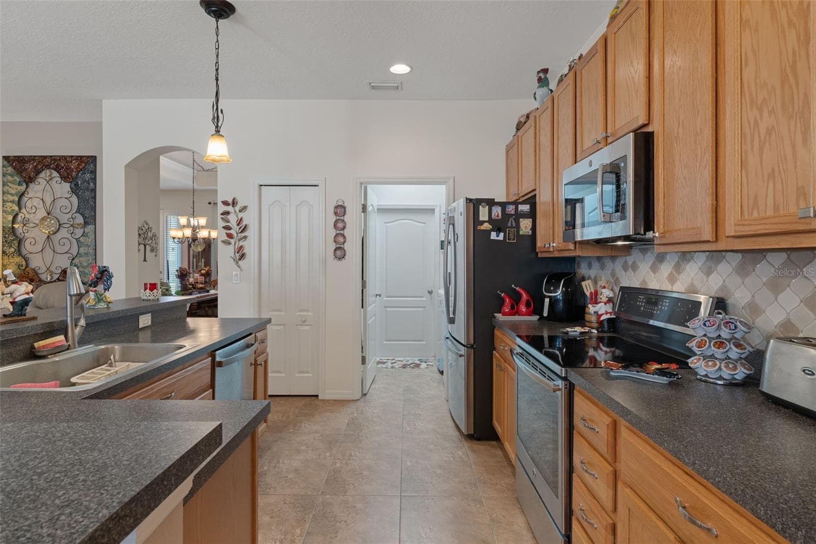 The Kitchen has a large pantry - 14056 LEYBOURNE WAY, SPRING HILL