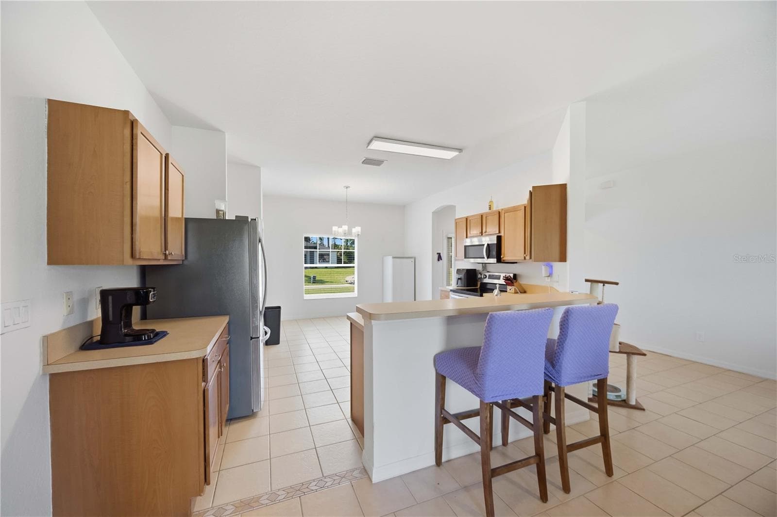 Kitchen is open to the living room - 1150 KNOTTY PINE AVE, NORTH PORT