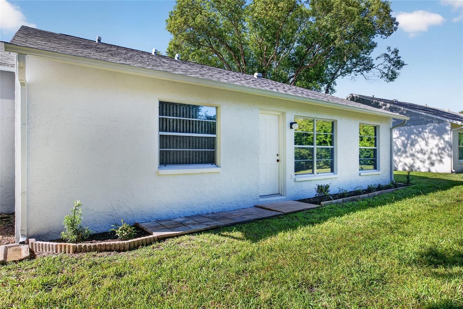 Rear Side View- 9545 Danville Court, #42, New Port Richey, FL 34655Wedgewood Village Condos in Heritage Lake - 9545 DANVILLE CT #42, NEW PORT RICHEY