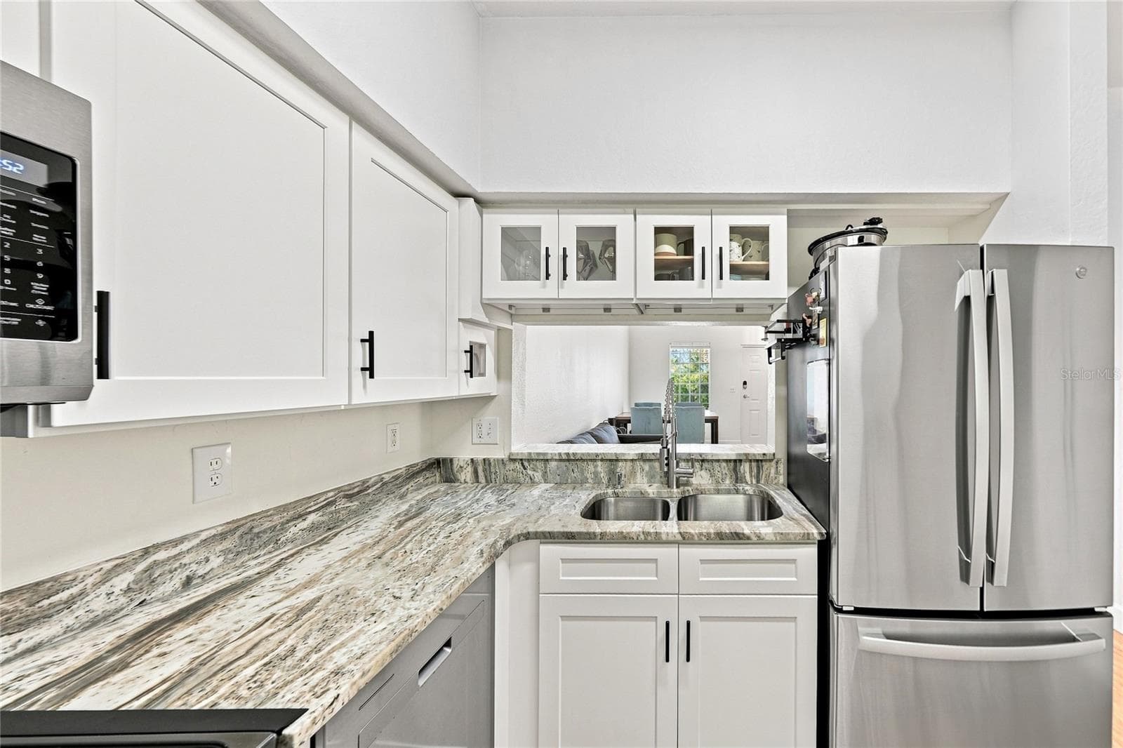 Updated kitchen with passthrough to great room/dining area - 8423 BERNWOOD COVE LOOP #410, FORT MYERS