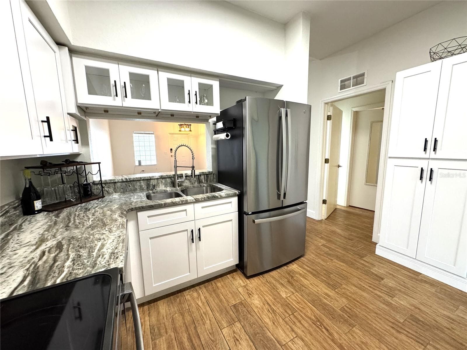 Kitchen with bonus pantry cabinet - 8423 BERNWOOD COVE LOOP #410, FORT MYERS