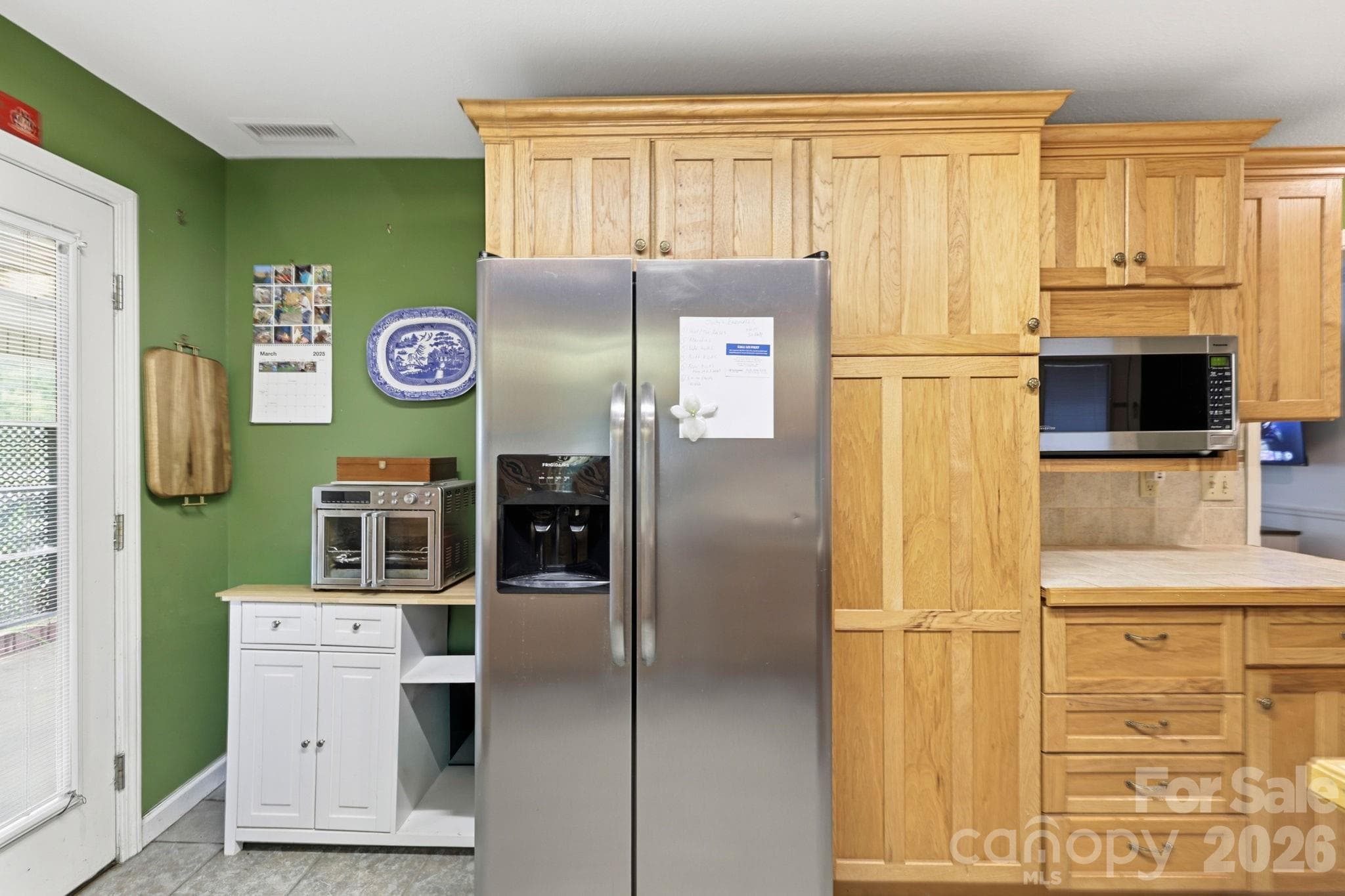 Refrigerator near door to carport - 10687 Cruso Road, Canton