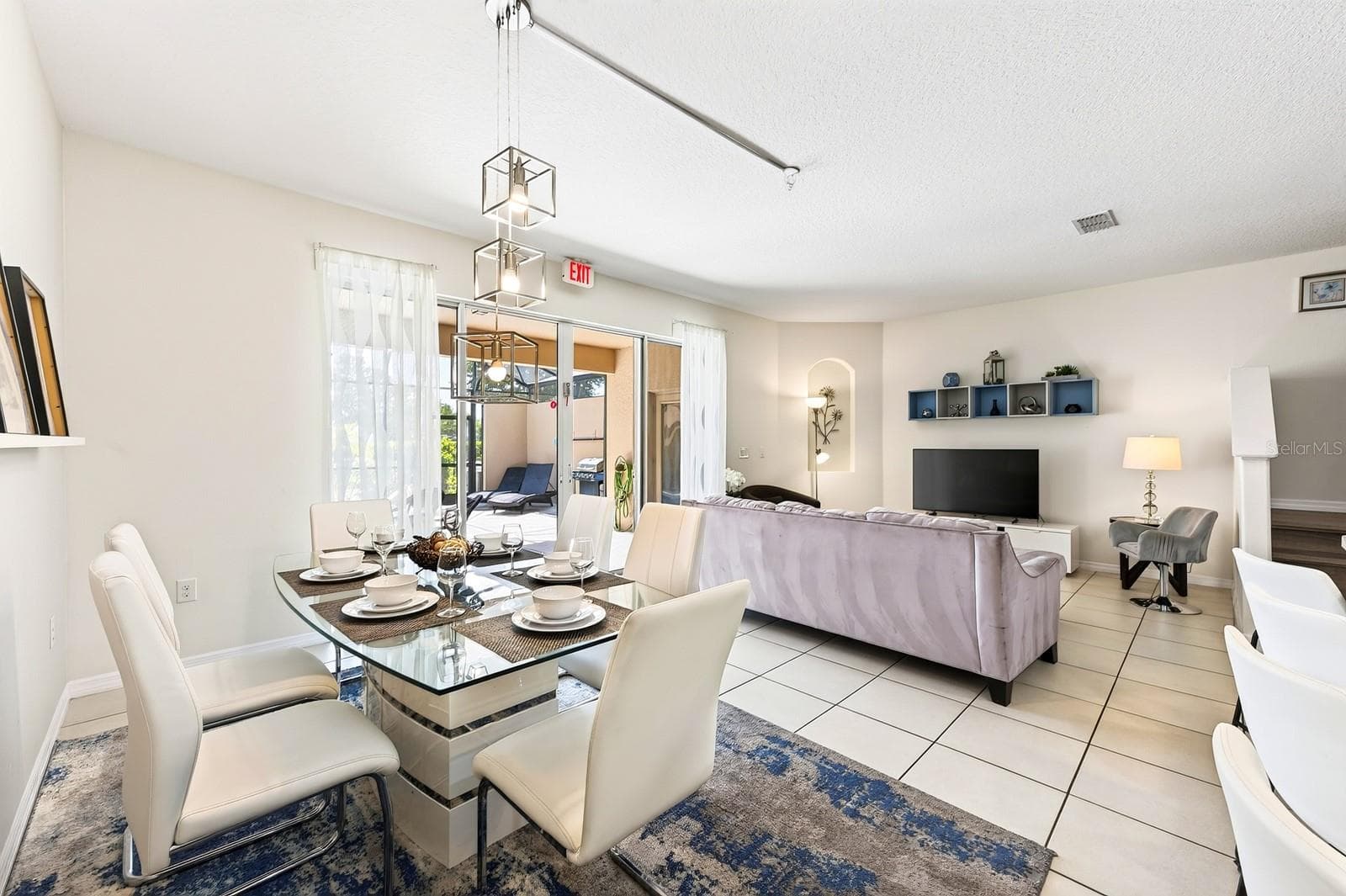The Dining Area sits just off the Kitchen and offers direct access through sliding glass doors to the outdoor living space. - 4722 TERRASONESTA DR, DAVENPORT