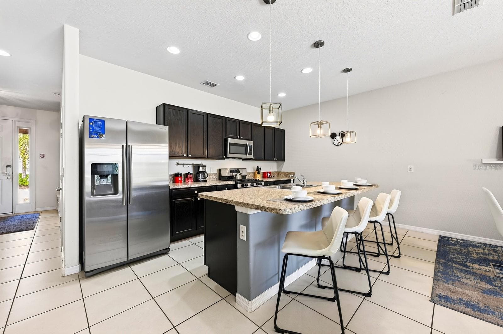 A generous center island offers extra prep space and room for counter-height seating. - 4722 TERRASONESTA DR, DAVENPORT