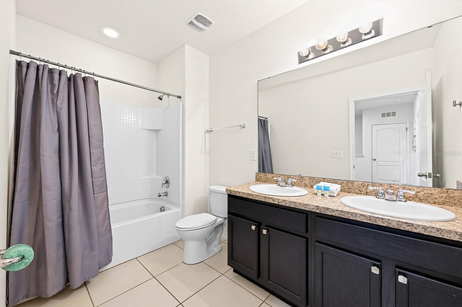 Two additional bedrooms share another full bath. - 4722 TERRASONESTA DR, DAVENPORT