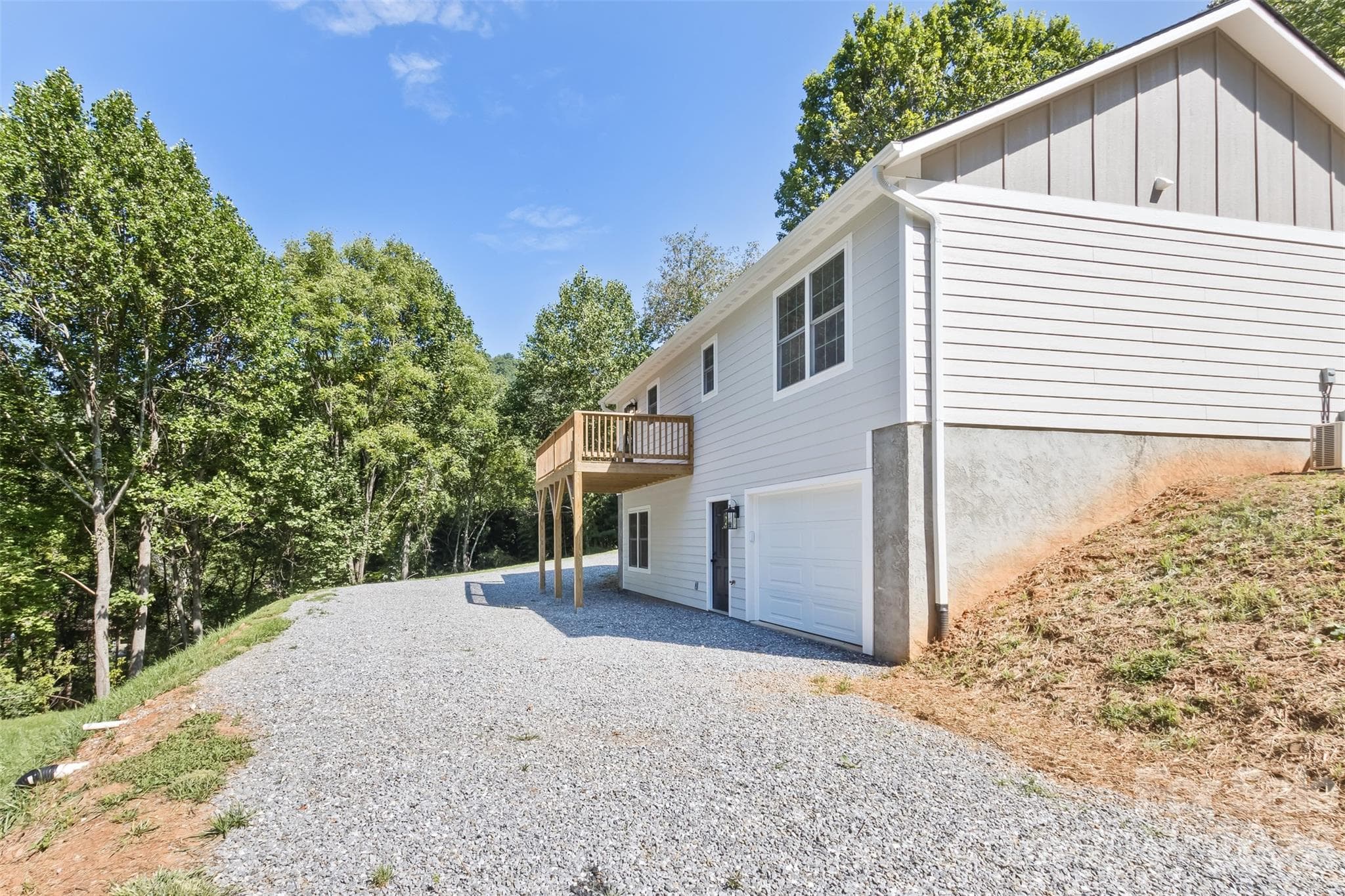 Back of home with access to garage and fininshed basement - 340 Matthew Lane, Canton
