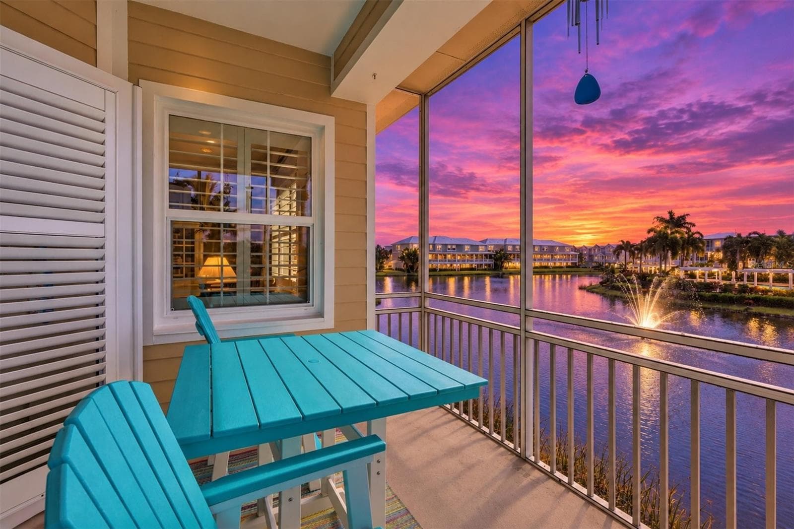 Sunset views overlooking the lake & fountain from Kitchen-Dining & Living Room - 10301 CORAL LANDINGS LN #5, PLACIDA