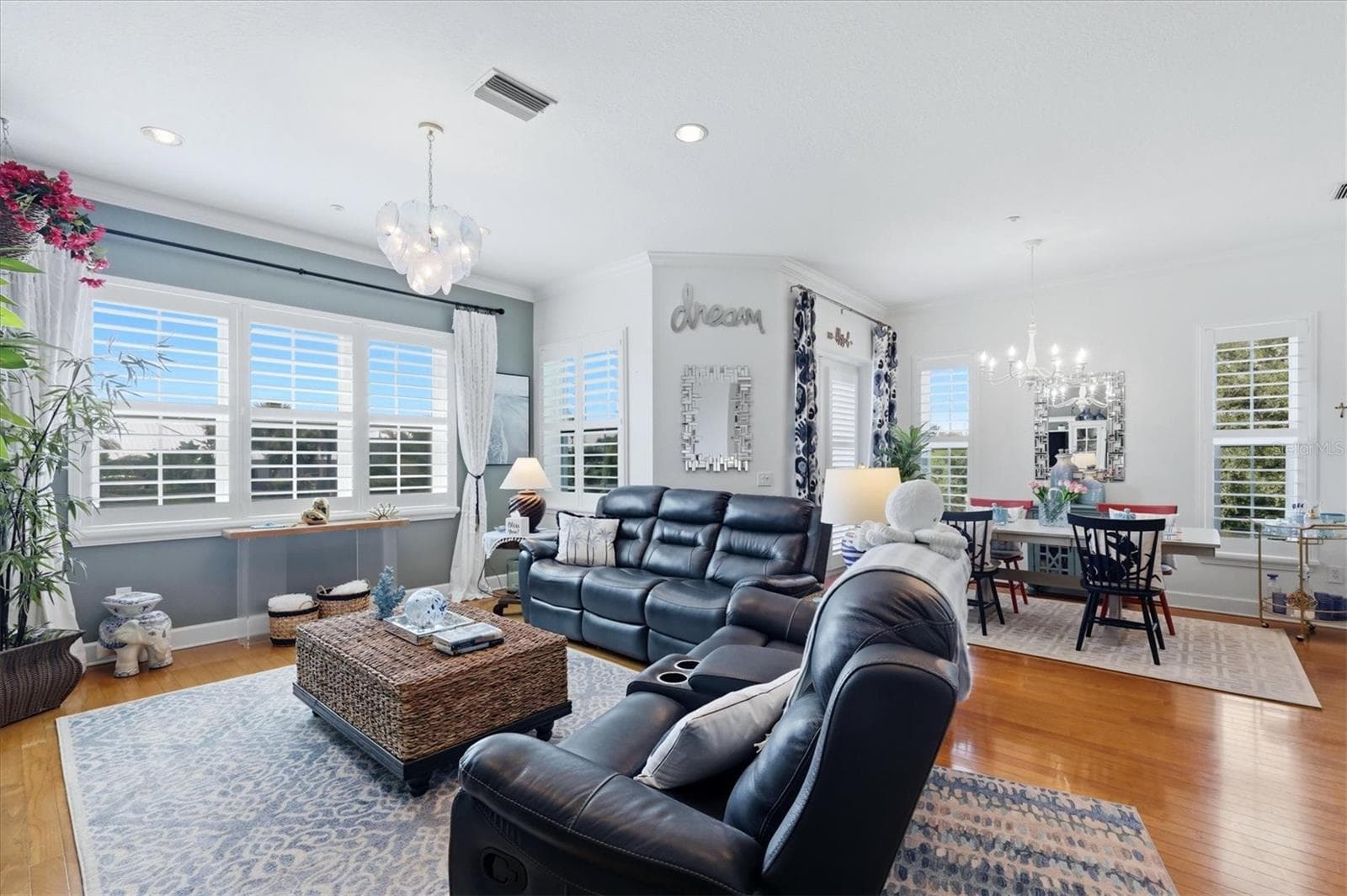 Living & Dining areas accented with plantation shutters on the brand new impact-resistant windows & doors - 10301 CORAL LANDINGS LN #5, PLACIDA
