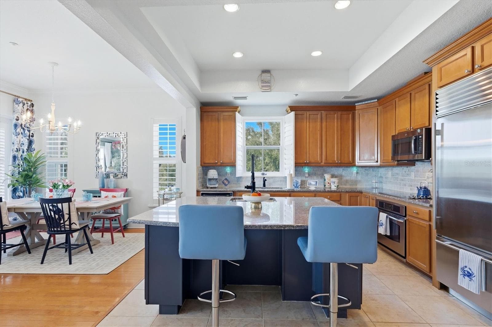 Kitchen with seating at center island - 10301 CORAL LANDINGS LN #5, PLACIDA