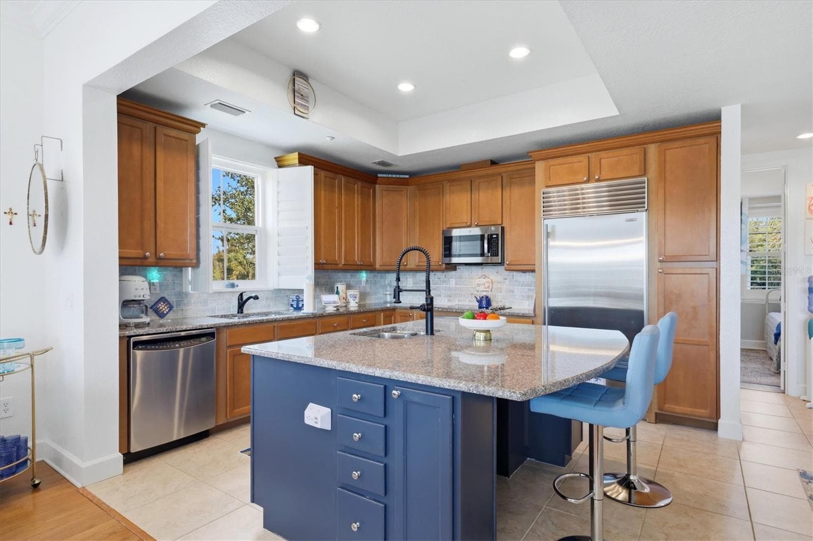 Kitchen features Sub-zero refrigerator and stainless appliances - 10301 CORAL LANDINGS LN #5, PLACIDA
