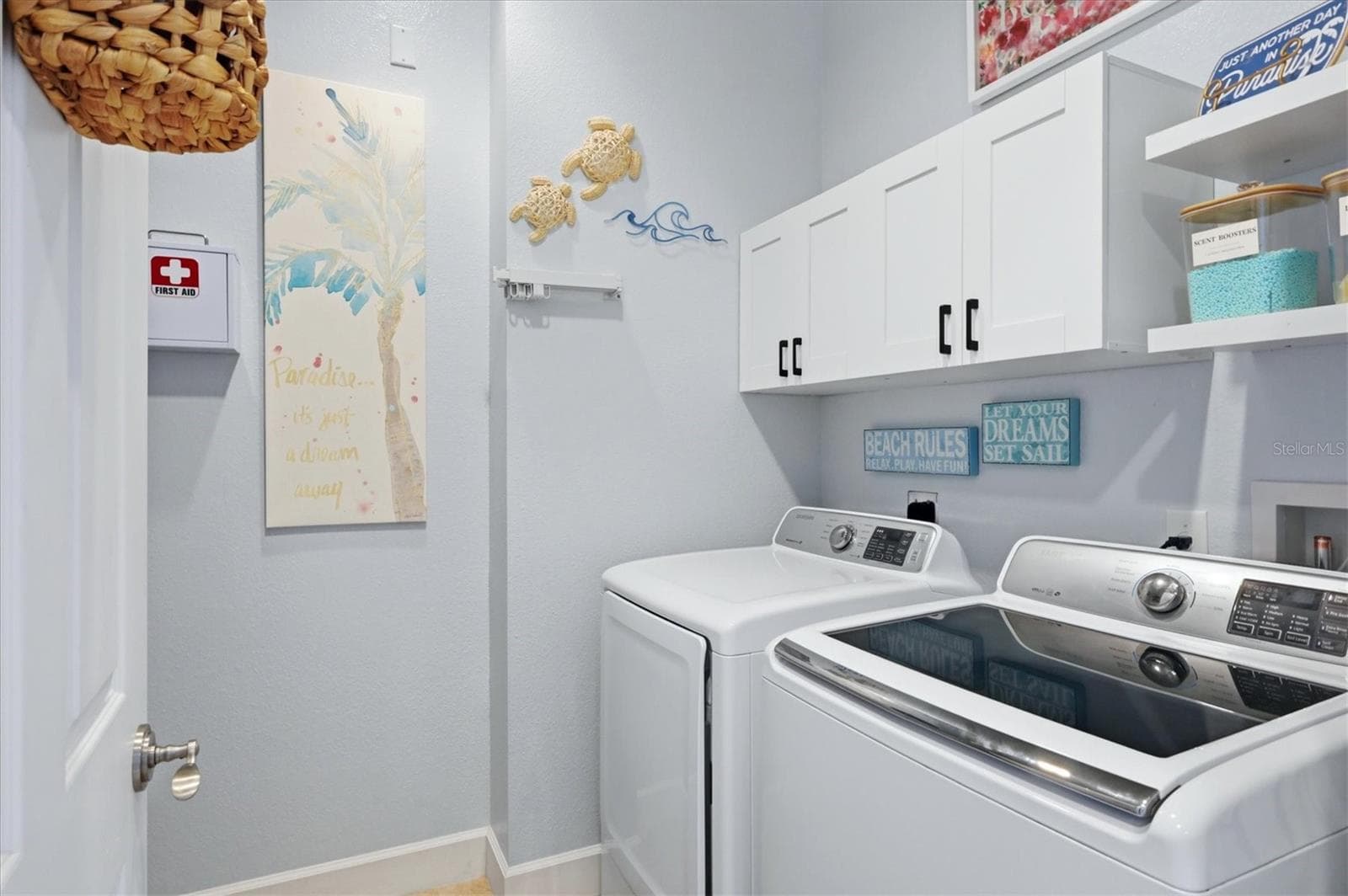 Laundry Room is located on upper level convenient to both Primary suites and includes a utility sink - 10301 CORAL LANDINGS LN #5, PLACIDA