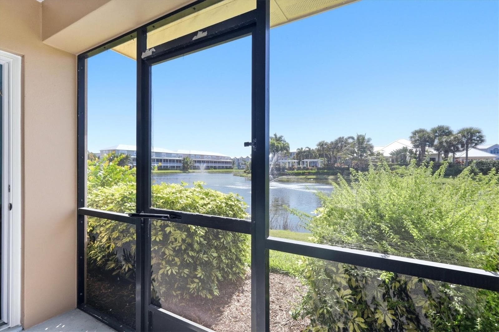 Screened lanai located off garage - 10301 CORAL LANDINGS LN #5, PLACIDA
