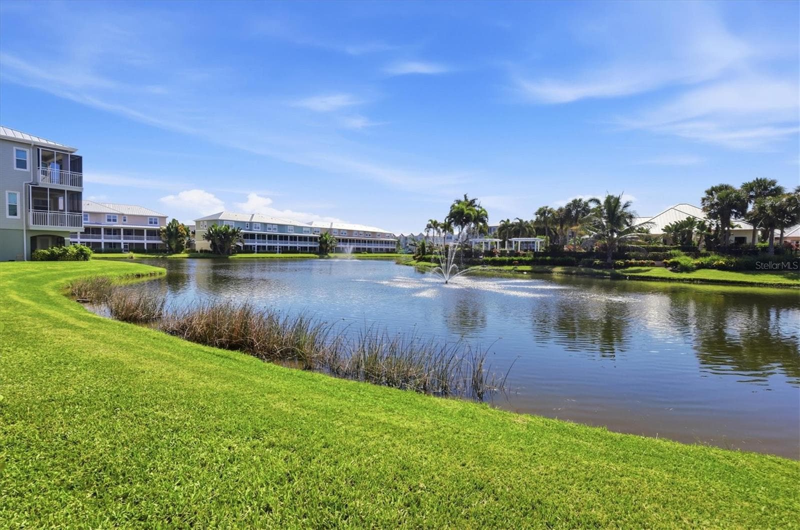 Lake & fountain views from ground level - 10301 CORAL LANDINGS LN #5, PLACIDA