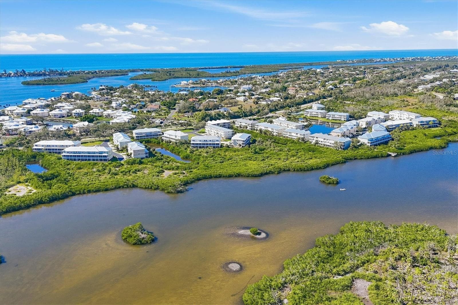 Water abounds everywhere with Coral Creek to the East and the Intracoastal & Gulf to the West - 10301 CORAL LANDINGS LN #5, PLACIDA