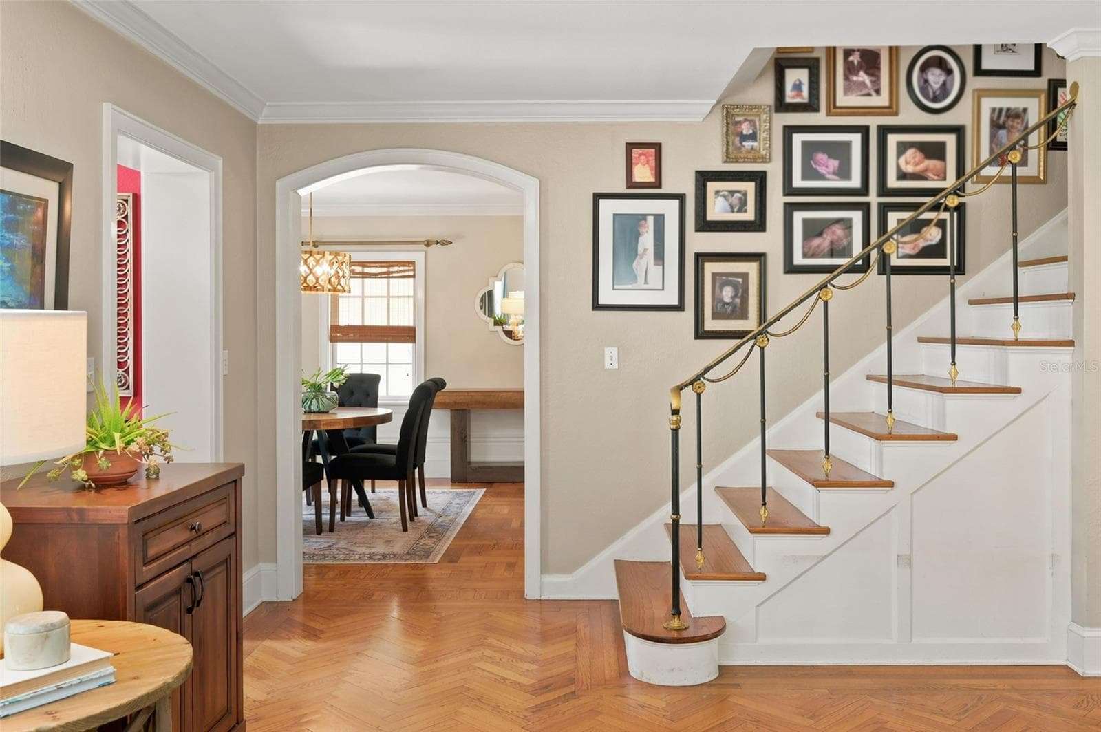Welcoming Foyer with Hardwood Floors, Custom Railing, Arched Doorways and Extensive Millwork. - 1221 DORCHESTER ST, ORLANDO