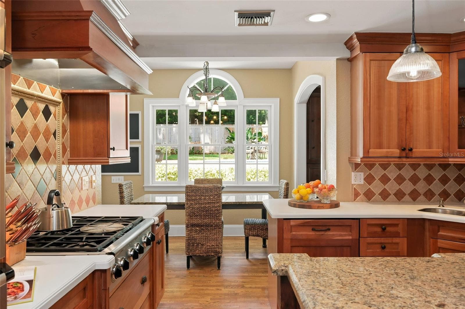 Kitchen Connects to Casual Eat-in Area and Formal Dining Spaces - 1221 DORCHESTER ST, ORLANDO