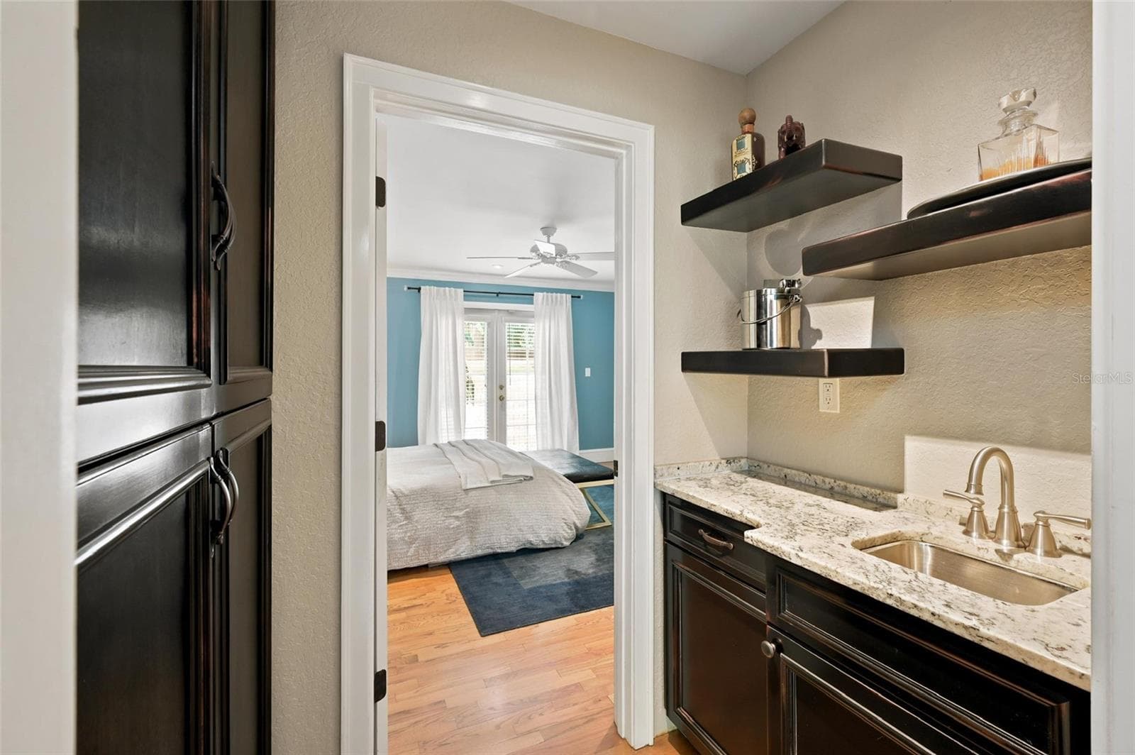 Convenient Storage and Wet Bar or Coffee Bar Well Located Between the Formal Living Room and Alternate Primary Bedroom - 1221 DORCHESTER ST, ORLANDO