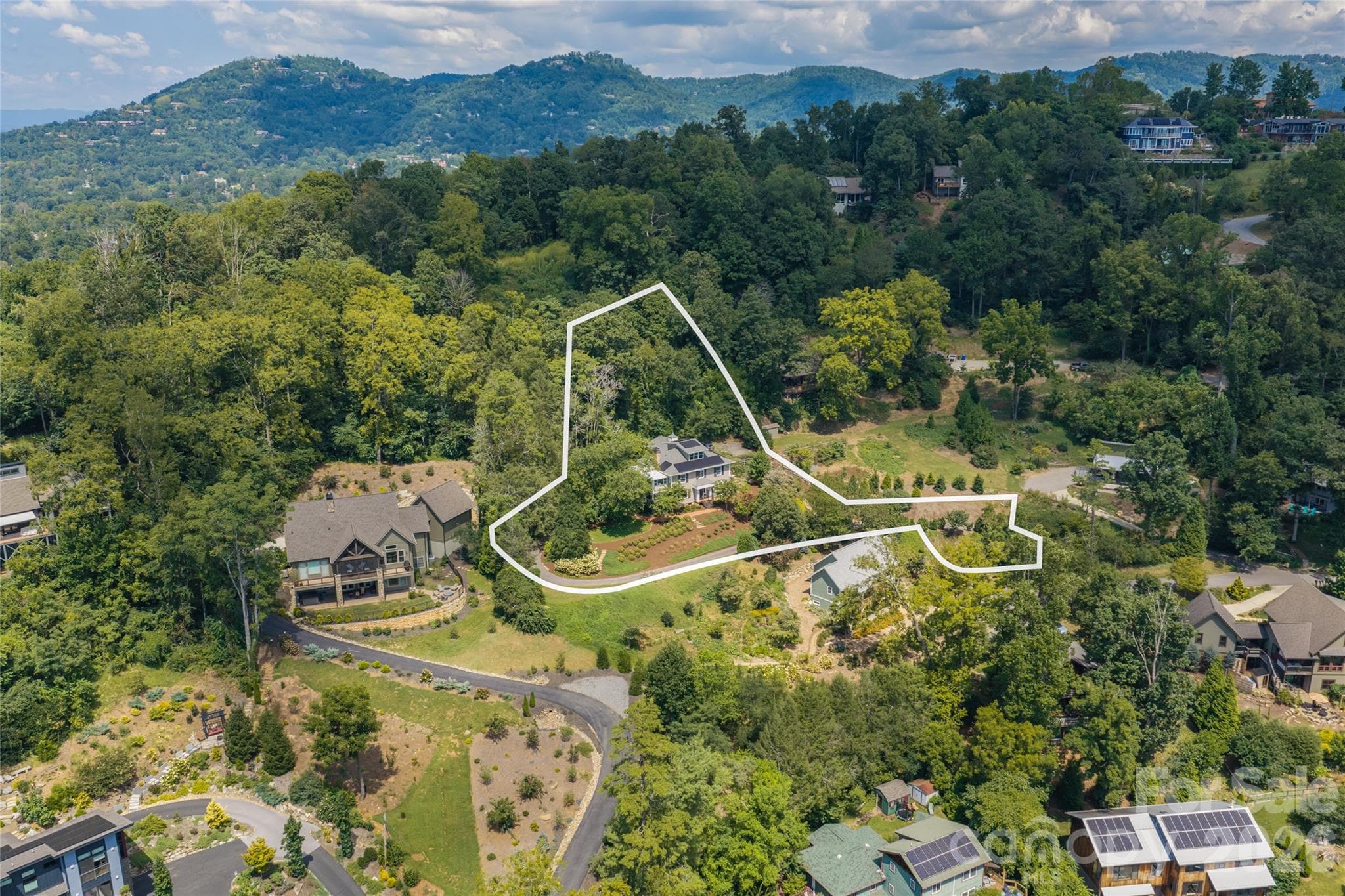 The home sits privately on one acre, with access to trails, and all Asheville has to offer - 35 Elias Place, Asheville