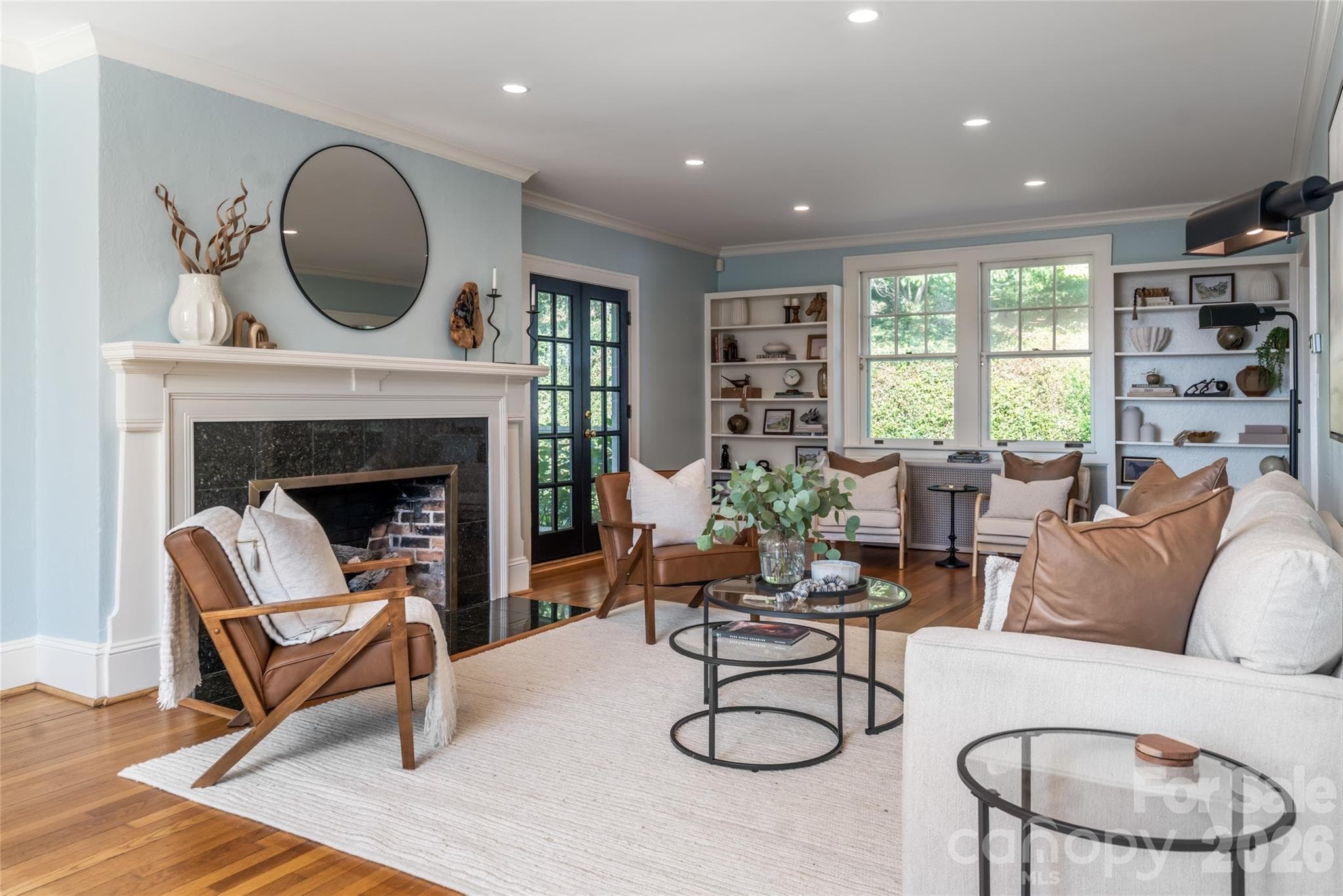 Large living room space with a gas fireplace, charming built-ins and access to the screened in porch - 35 Elias Place, Asheville
