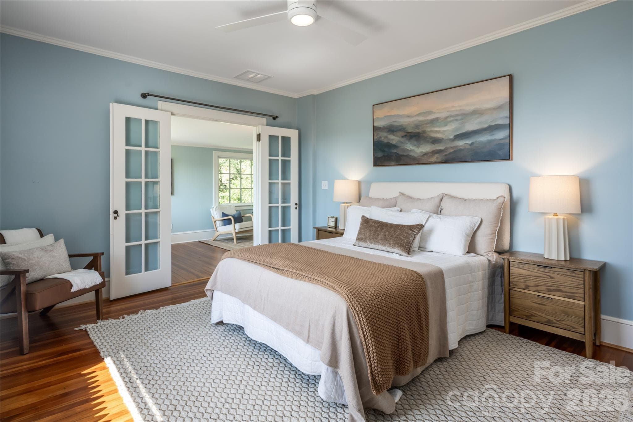 The primary bedroom has views of downtown Asheville and the Blue Ridge Mountains. It also has french doors to a private sitting room. - 35 Elias Place, Asheville