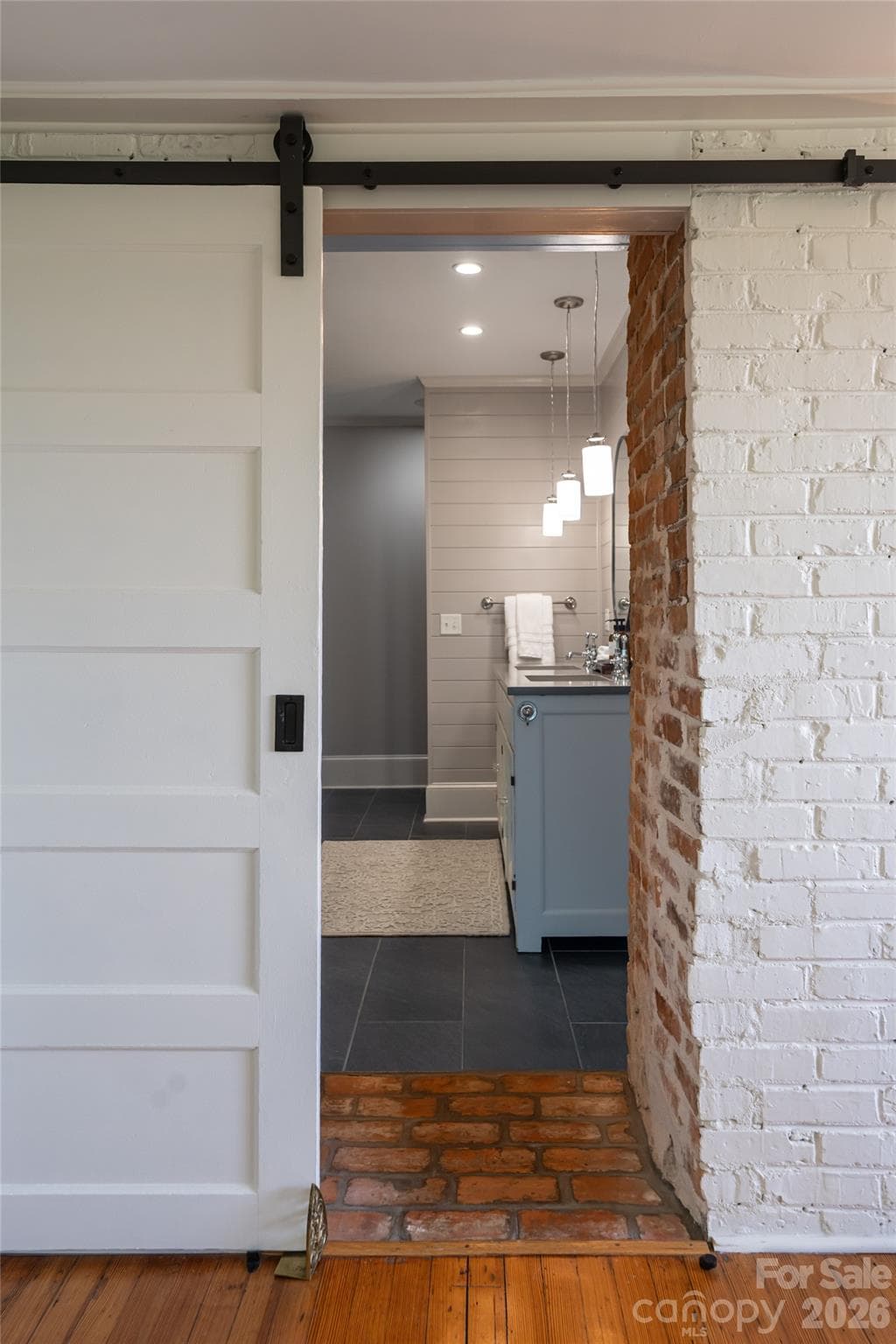 The primary bathroom is accessed through the private sitting room for the primary bedroom. - 35 Elias Place, Asheville