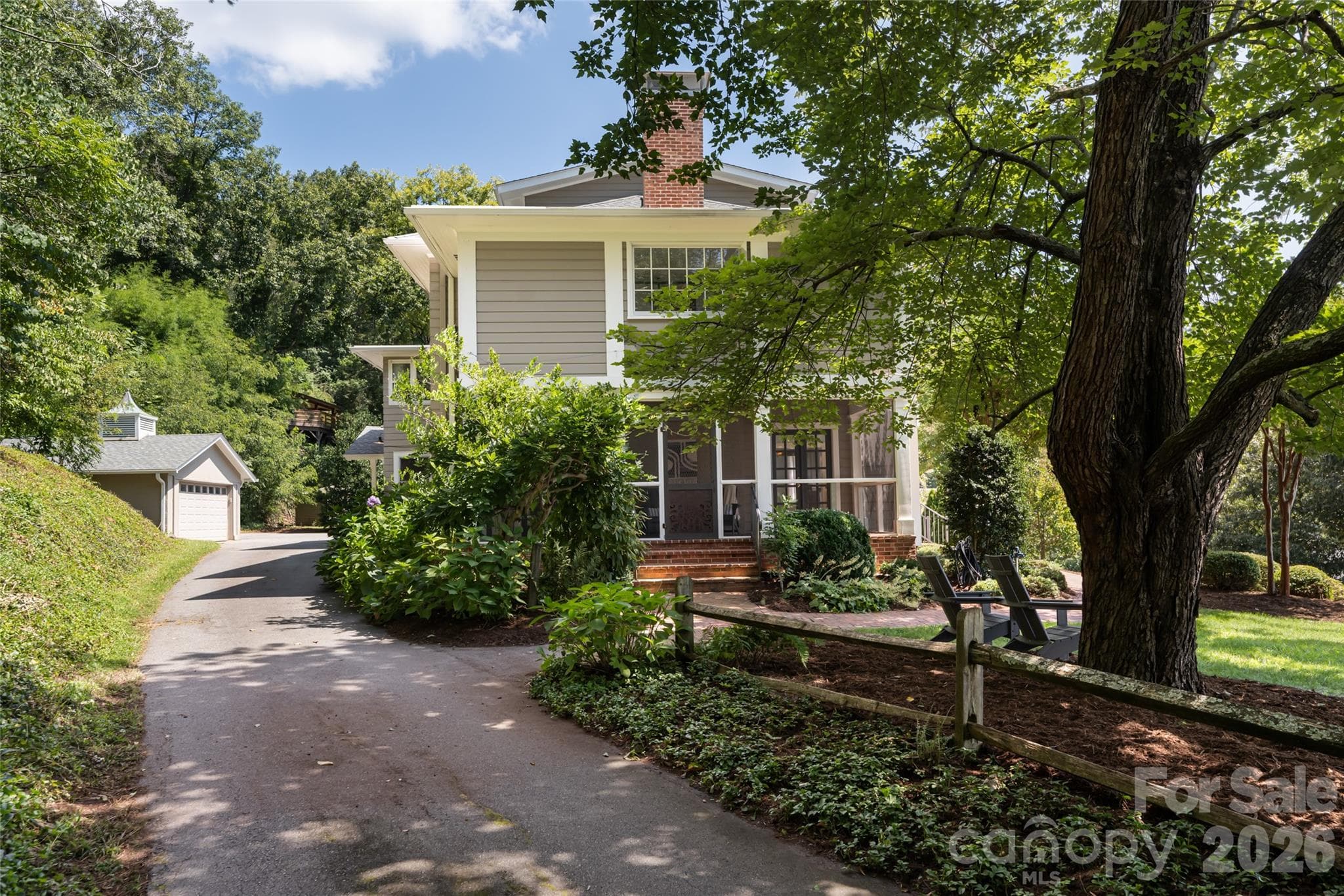 The private driveway wraps around the home creating the most peaceful entrance upon arrival. - 35 Elias Place, Asheville