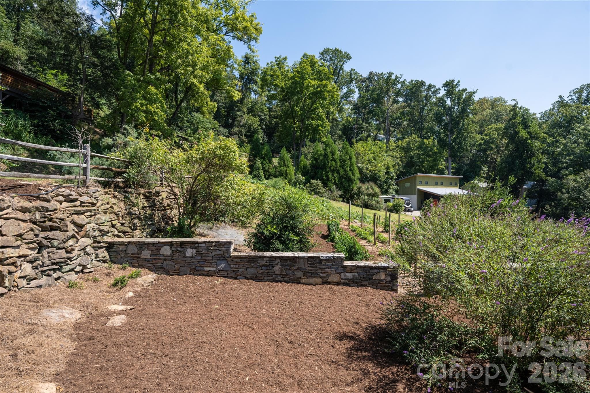The home features a large garden space with fruit trees and ample space for a vegtable garden or to create a rose garden or play area. - 35 Elias Place, Asheville