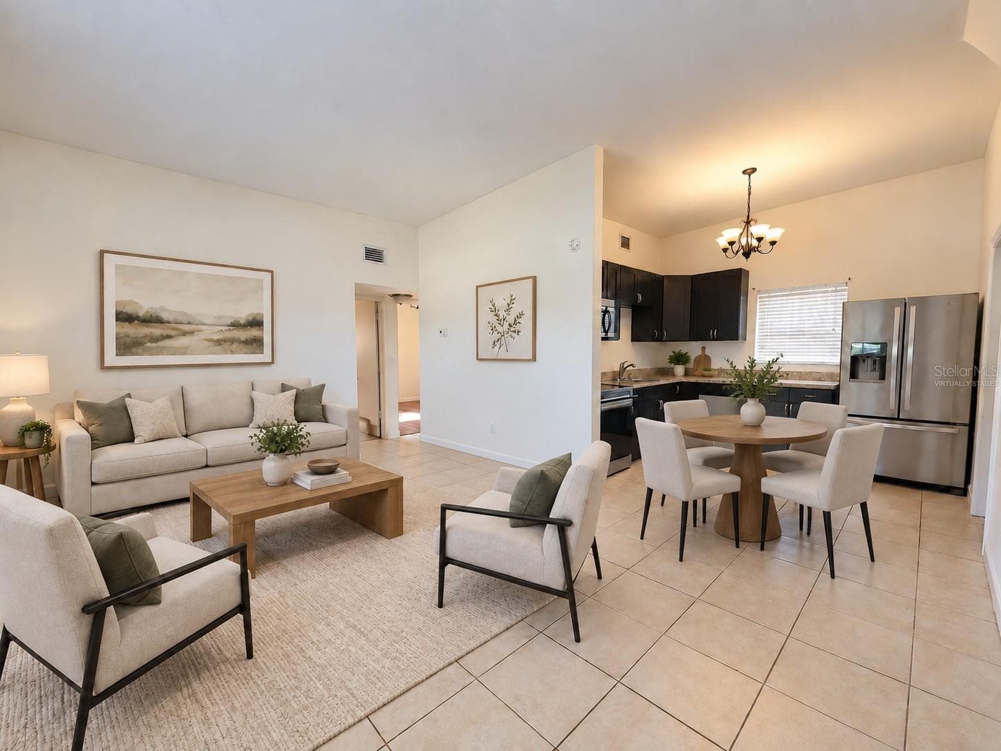 Virtually staged LR/Kitchen - 6711 DARTMOUTH AVE N, ST PETERSBURG