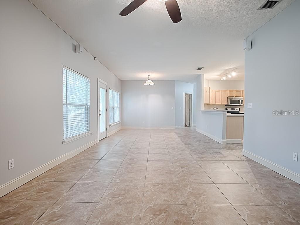 Living room back view - 1306 RAIN FOREST LN, MINNEOLA