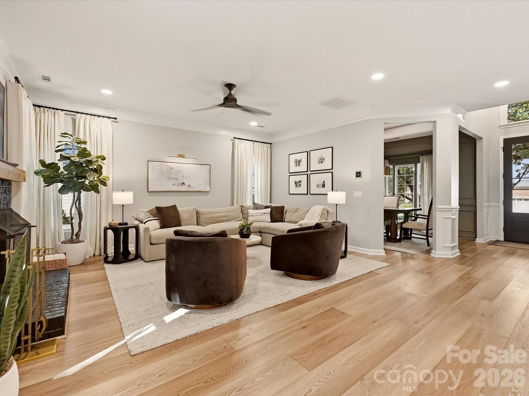 Open living area offers generous entertaining space with seamless flow between the family room and updated kitchen. - 19706 Valiant Way, Cornelius