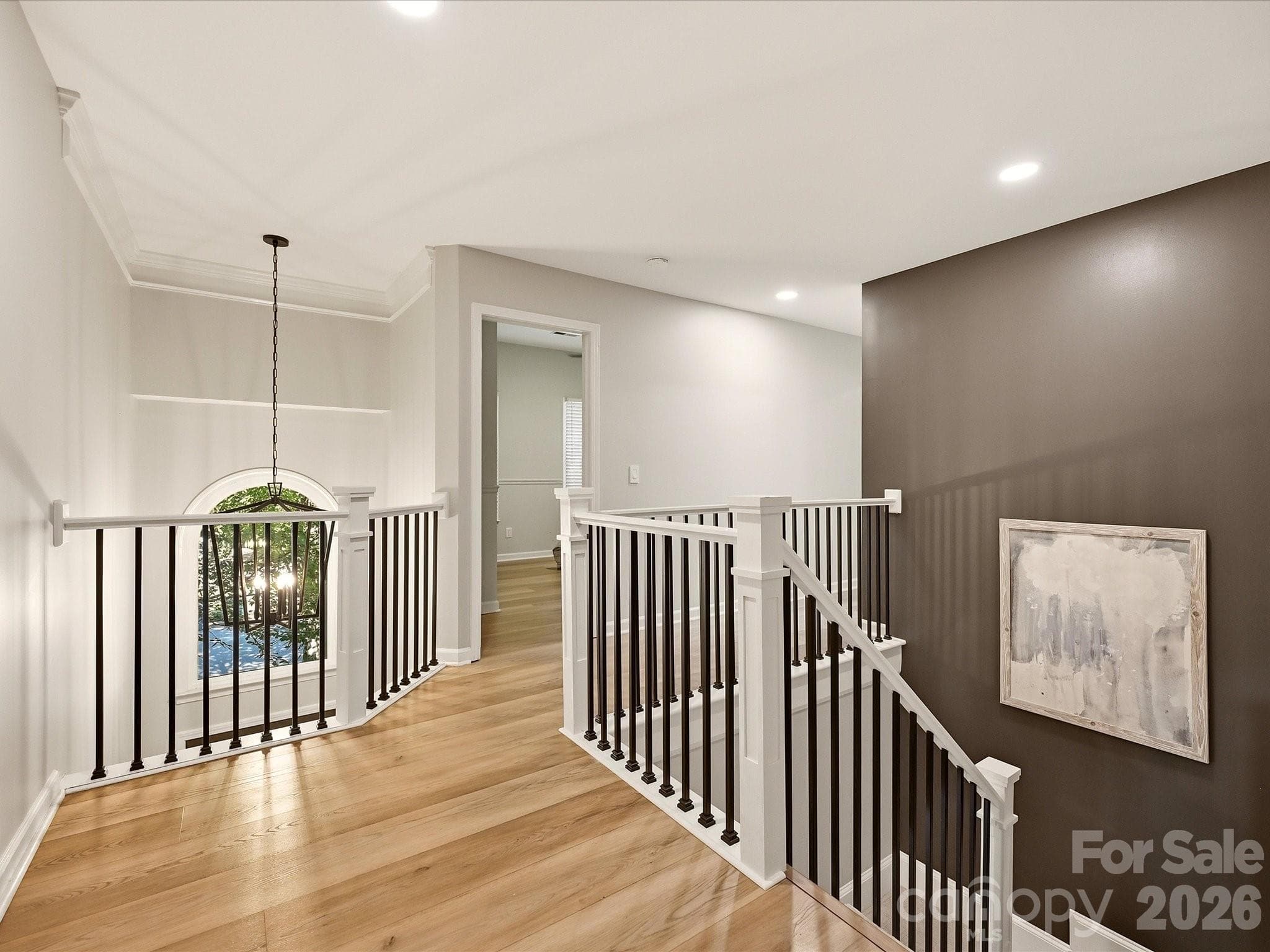 Open upper-level landing provides easy access to the home's bedrooms and additional living spaces. - 19706 Valiant Way, Cornelius