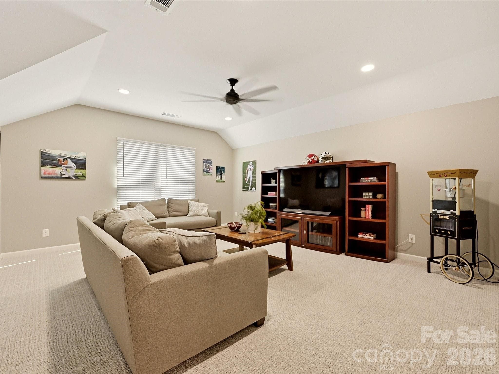 Expansive upper-level bonus room offers versatile space for a bedroom, media room, playroom, or second living area. - 19706 Valiant Way, Cornelius