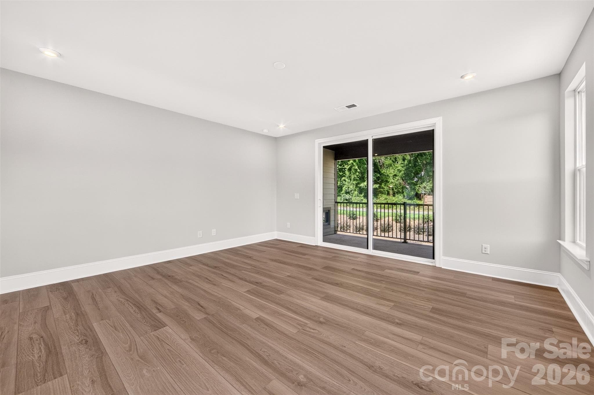 Great room with access to the covered outdoor living - 411 Old Town Village Road, Waxhaw