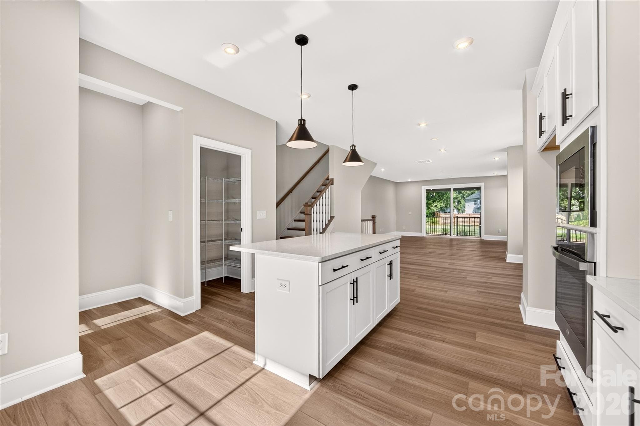 Gourmet kitchen with island and a Walk-in pantry - 411 Old Town Village Road, Waxhaw
