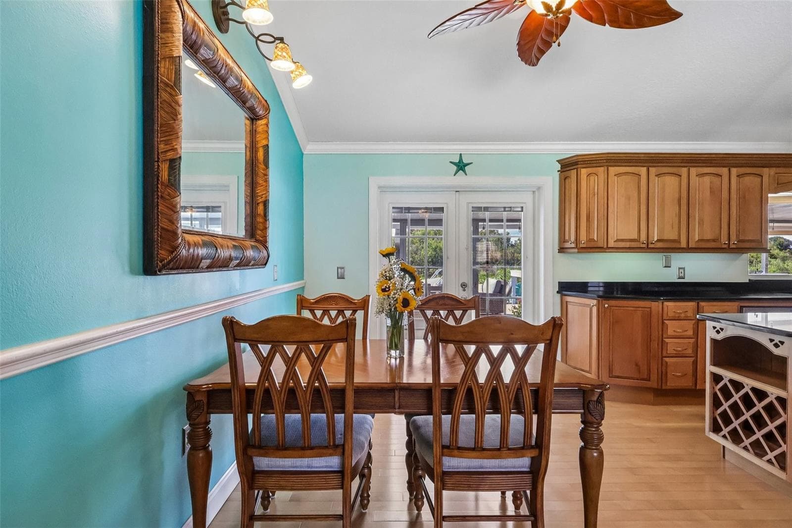 Dining area with French doors with blinds inserts to screened in Patio and beyond - 28116 LOIS DR, TAVARES