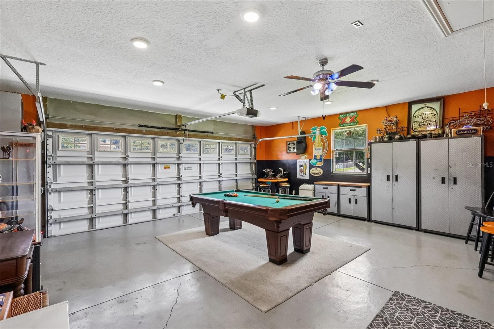 Work shop and Billiard table /Owner had designed with your favorite motorcycle memorabilia and decor and never used for cars, but it can always go back to being "Just a Garage" - 28116 LOIS DR, TAVARES