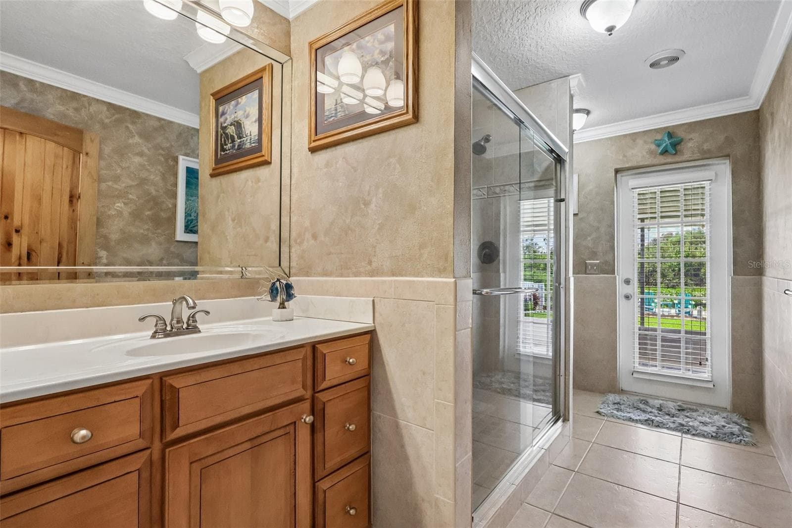 exquisite Guest Bathroom with door to screened in patio runs along the back of house - 28116 LOIS DR, TAVARES