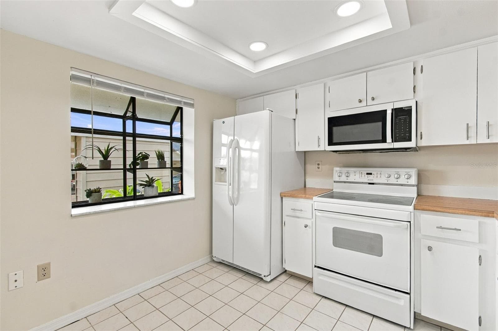 Kitchen w/ Plant Shelf Window - 7610 OAKMONT LN, NEW PORT RICHEY