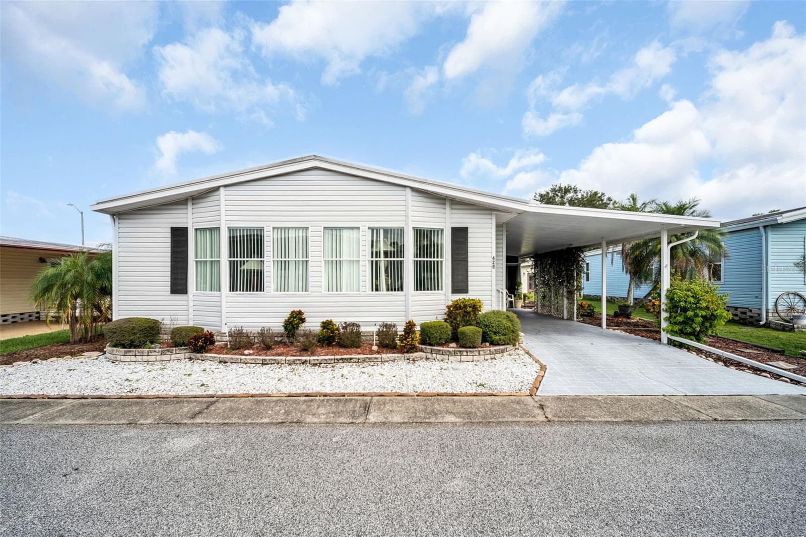 Front of him and carport - 428 PELICAN DR S, OLDSMAR